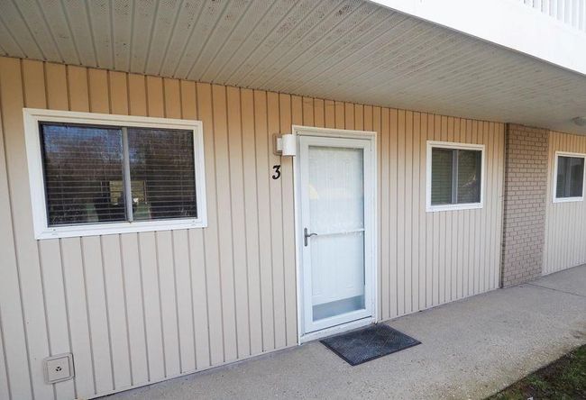 Property entrance with brick siding | Image 4