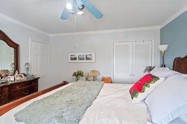 Bedroom featuring ornamental molding and ceiling fan | Image 11
