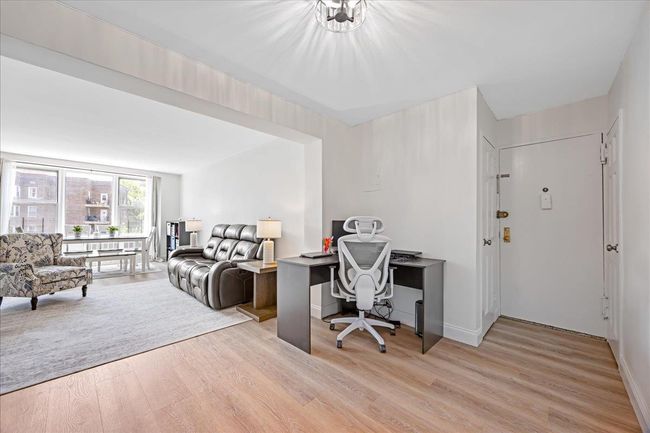Home office with light wood-type flooring and baseboards | Image 18