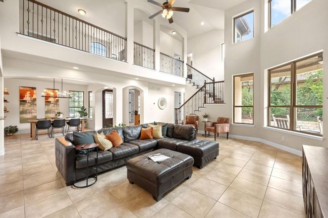 Living room with high ceilings, open to two dining areas and kitchen | Image 8