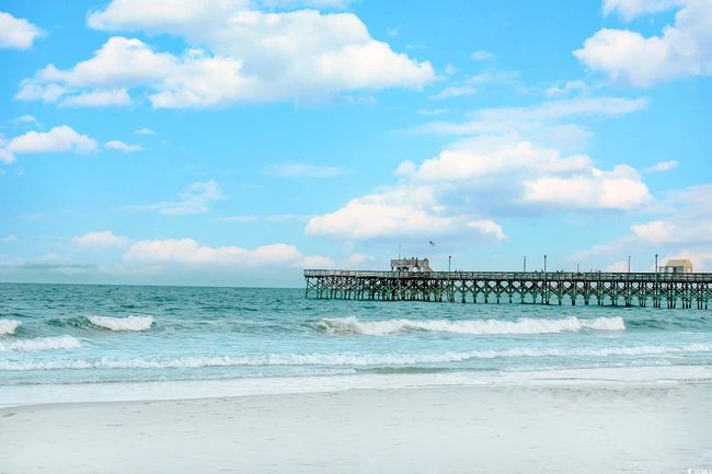 Water view with a pier and local beach | Image 33