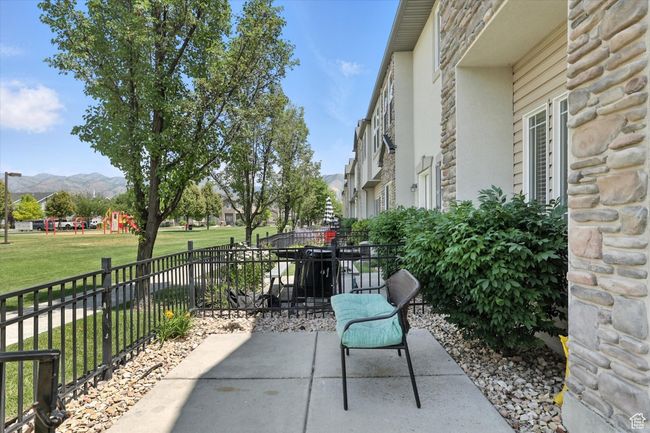 View of patio with a mountain view and a playground | Image 29