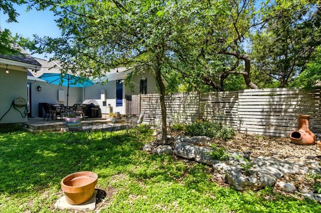 View of yard featuring a patio area and a fenced backyard | Image 37