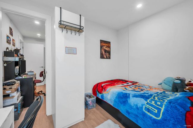 Bedroom featuring wood finished floors and recessed lighting | Image 25