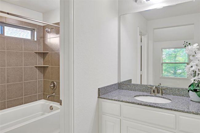 Full bath featuring shower combination and vanity | Image 28