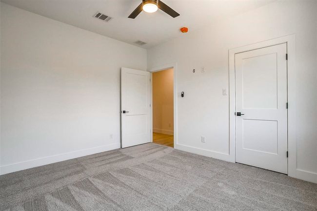 Unfurnished bedroom featuring carpet floors, baseboards, and ceiling fan | Image 29