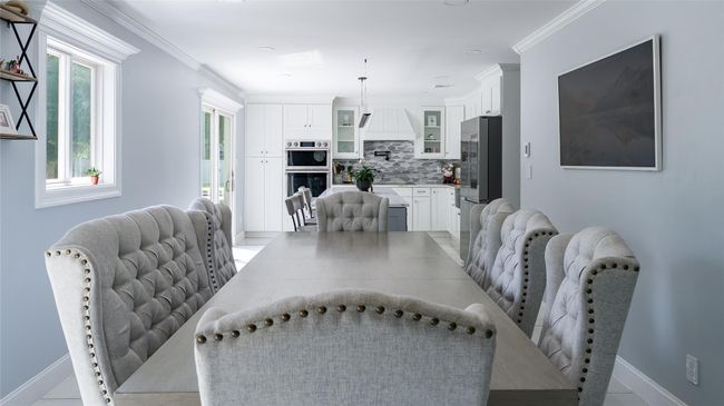 Dining area featuring ornamental molding | Image 10
