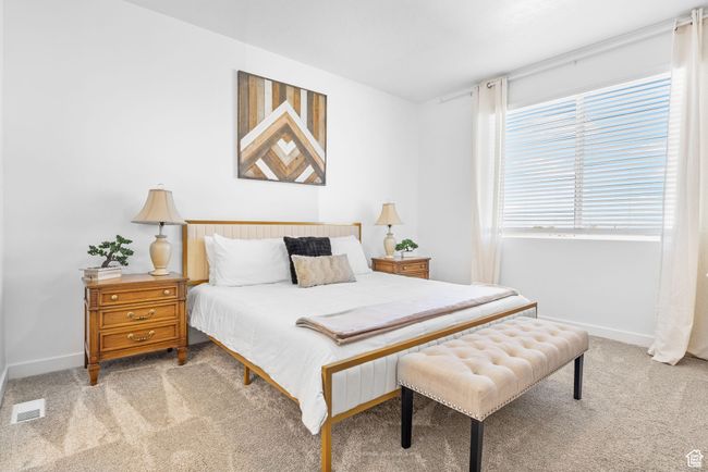 Bedroom with baseboards, visible vents, and carpet flooring | Image 19