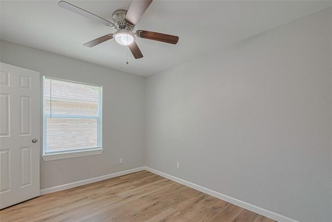 This additional view highlights the light color palette and generous layout that continues throughout the home. | Image 21