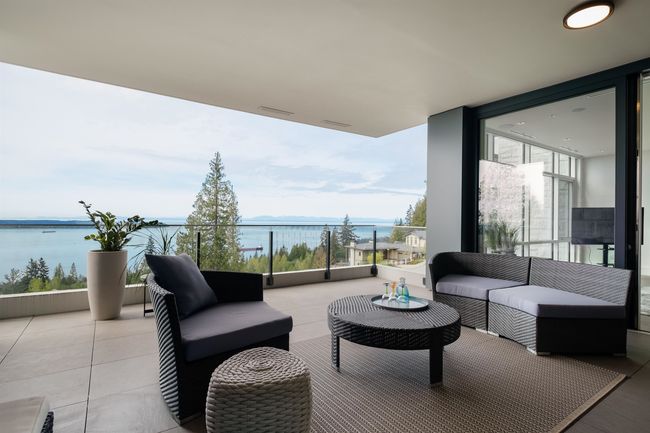 Patio / terrace featuring a water view and outdoor lounge area | Image 30