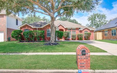 Lovely elevation with mature trees and custom mail box | Image 3