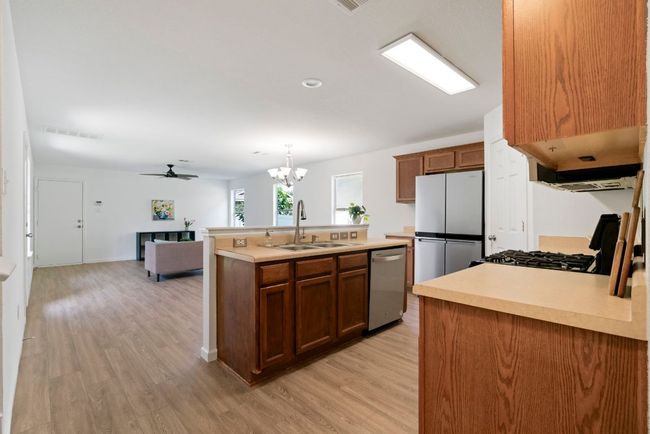 Step into a kitchen that perfectly balances openness and functionality, serving as the heart of the home. | Image 9