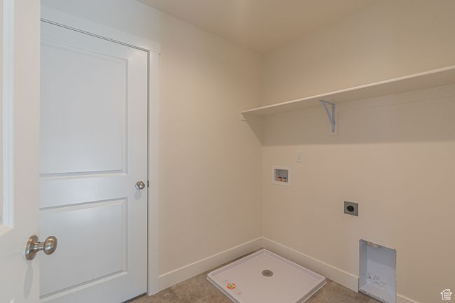 Laundry room with hookup for a washing machine and hookup for an electric dryer | Image 16