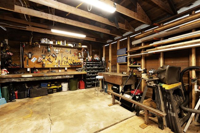 Garage featuring a workshop area | Image 24