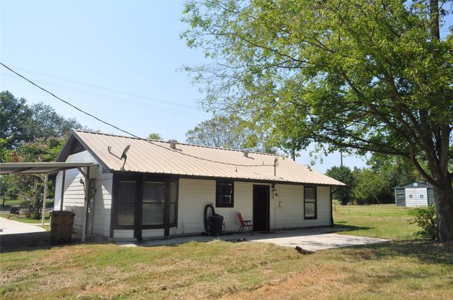 Back of property featuring a carport and a yard | Image 11
