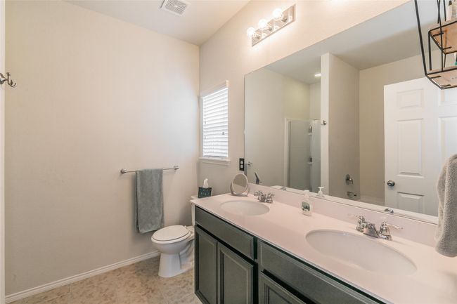 Full bathroom featuring toilet, shower / washtub combination, and vanity | Image 30