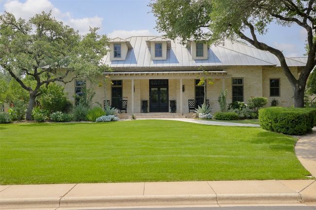 Modern inspired farmhouse with french doors, covered porch, a standing seam metal roof | Image 35
