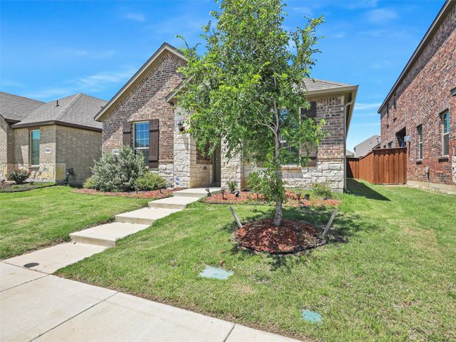 View of front of property with brick siding, stone siding, and a shingled roof | Image 23