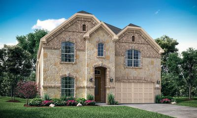 View of front facade with a garage and a front lawn | Image 1