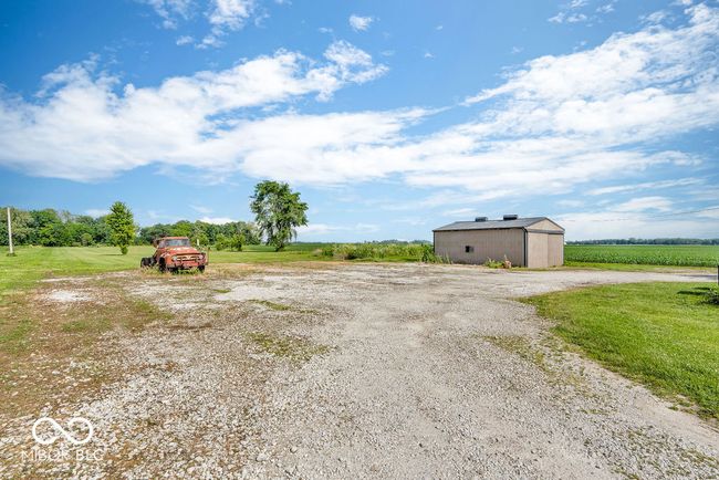 view of yard featuring a view of rural / pastoral area and an outdoor structure | Image 46
