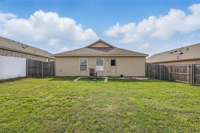 Rear view of property with a lawn and a fenced backyard | Image 10