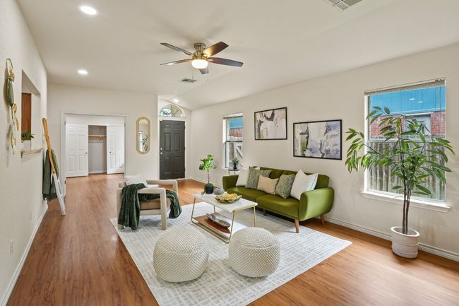 Tall ceilings and recessed lighting make the living room feel bright and spacious. 9349 Bernoulli Dr., Austin, TX 78748 | Image 4
