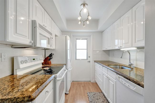 Beautiful granite countertops and plenty of kitchen cabinets | Image 14