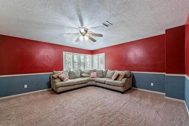 Across the hall is another bedroom. This one is being used as a gameroom. | Image 26