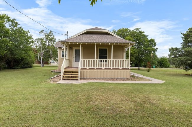 Rear view of property covered porch | Image 26