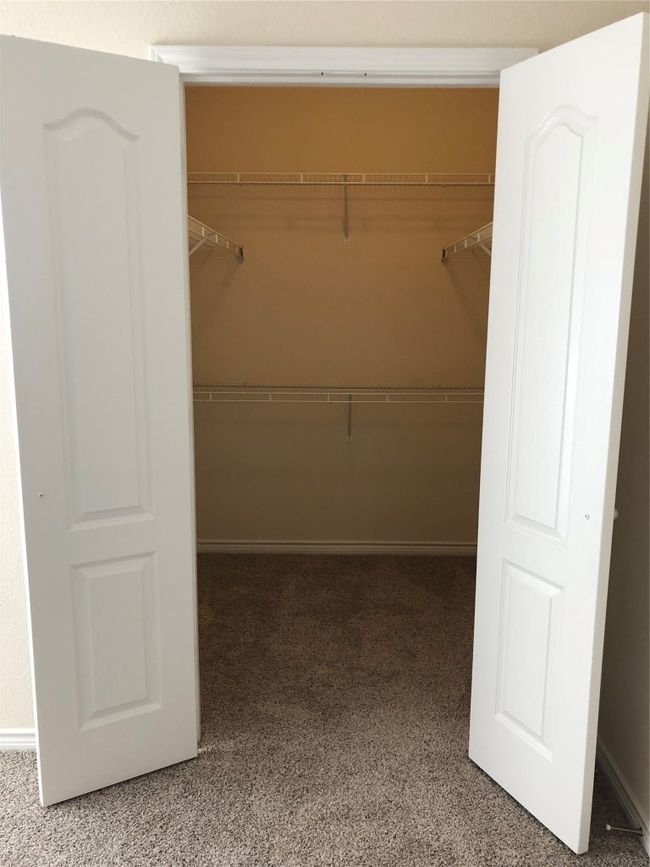 Walk in closet featuring carpet flooring | Image 4