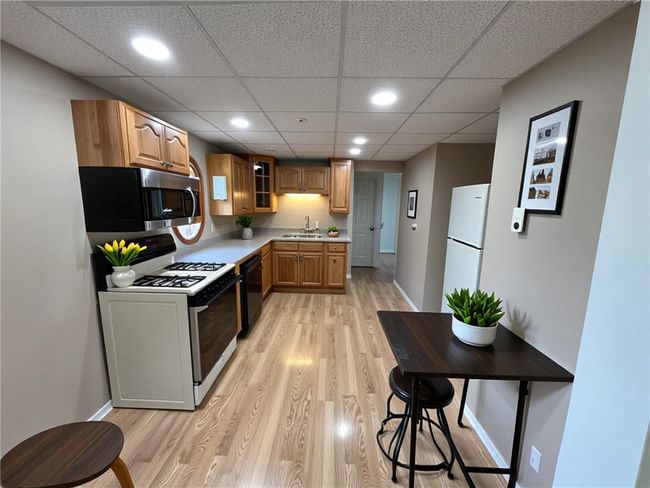 Kitchen- The furnishings and decor shown have been virtually staged. | Image 4