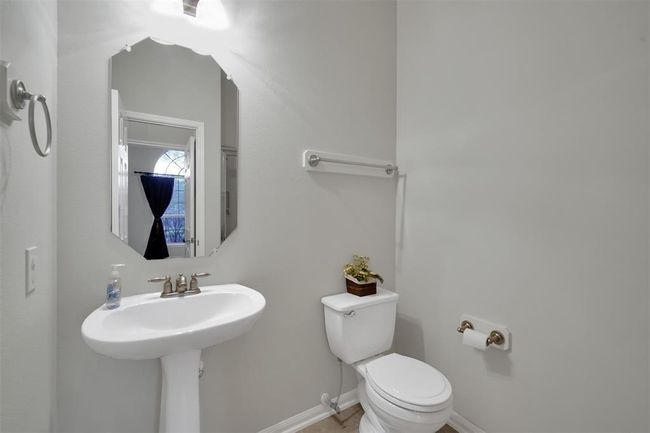 Guest bathroom located downstairs features full shower | Image 10