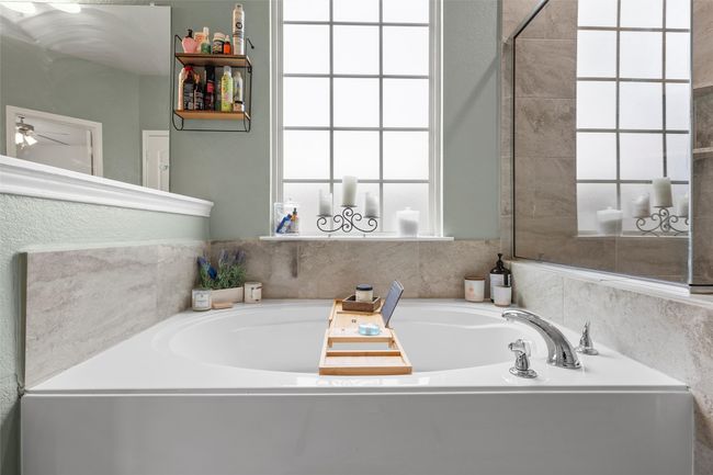 Full bath with a bath and a ceiling fan | Image 18