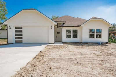 View of front of house featuring a garage | Image 1