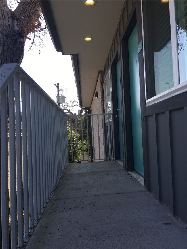 View of side of property with board and batten siding and a balcony | Image 13