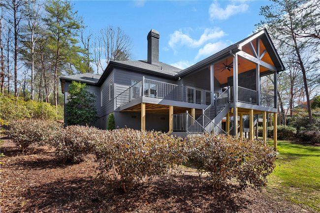 New covered porch and deck on the rear of the home. | Image 37