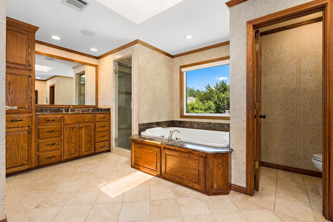 Master Bath walk-in shower, oversized Jacuzzi tub, and double anity | Image 12