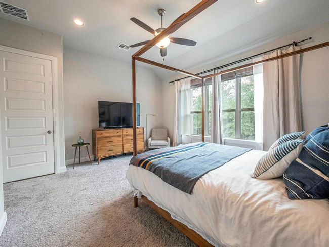 Carpeted bedroom with recessed lighting, vaulted ceiling, and a ceiling fan | Image 13