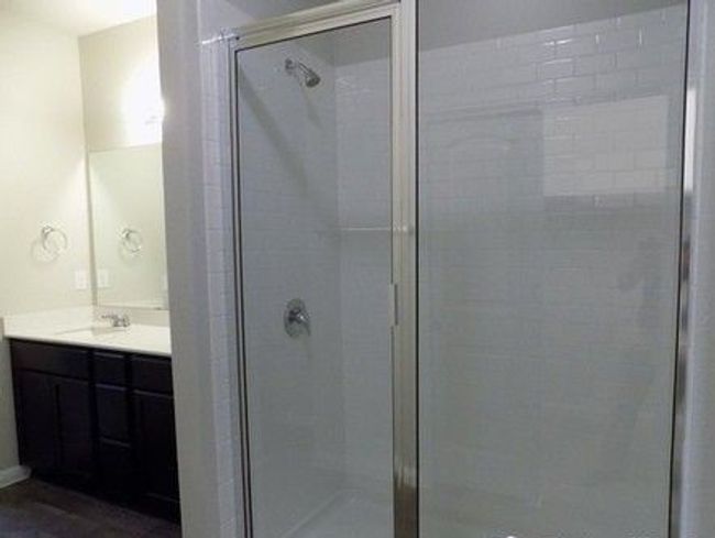 Full bathroom with vanity and a stall shower | Image 7