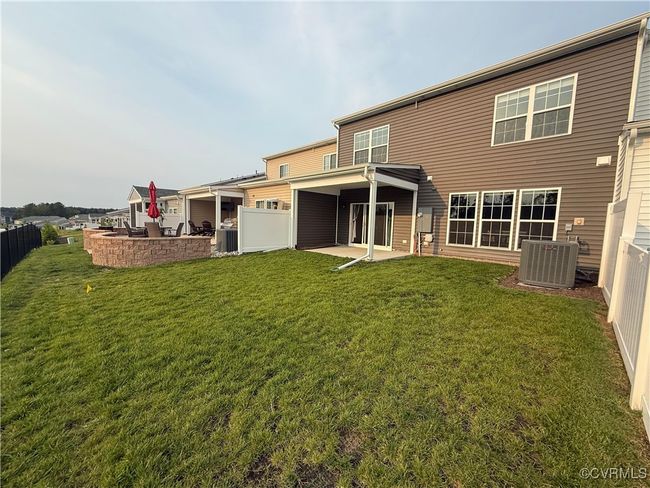 Back of house with cooling unit and a patio area | Image 23