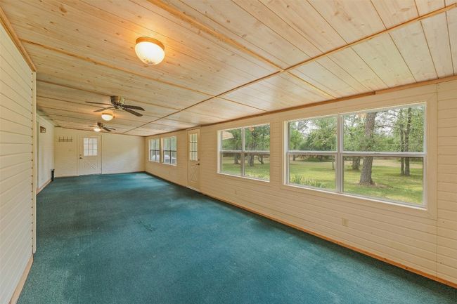 Massive sun room on the back of the house 40 feet long going out to the backyard porch. | Image 20