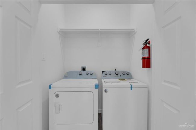 Laundry room with washer and clothes dryer | Image 20