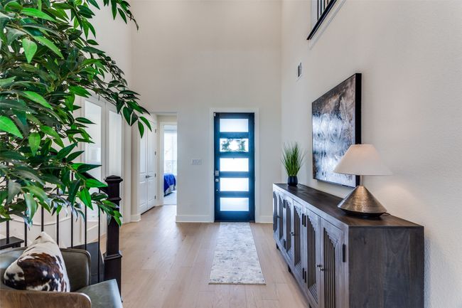 Entryway with light wood-style flooring and a high ceiling | Image 4