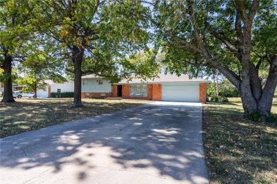 View of front facade featuring a garage | Image 2