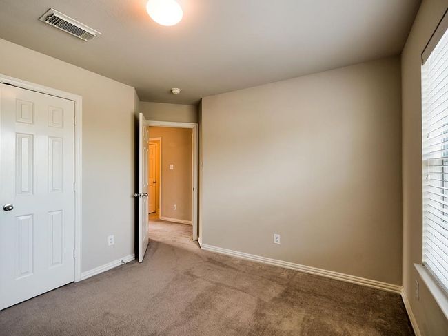 Unfurnished bedroom featuring carpet floors and baseboards | Image 38