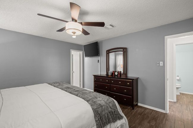 With its ample space and peaceful ambiance, the primary bedroom offers a perfect balance of relaxation and style, making it the ideal place to end your day | Image 17