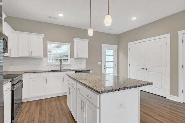 Bright white design w/ample cabinet space | Image 10