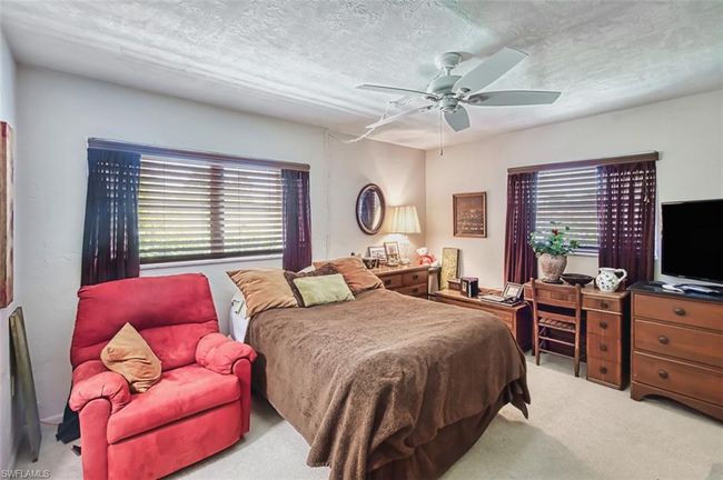 Carpeted bedroom featuring ceiling fan | Image 22