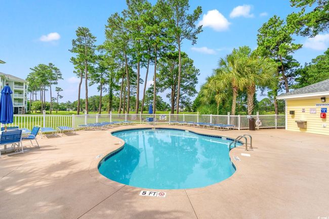 Community pool with a patio area | Image 26