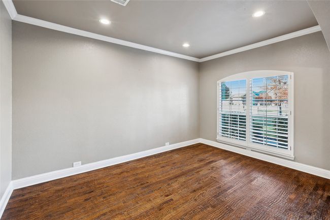 Unfurnished room featuring hardwood / wood-style floors and crown molding | Image 28